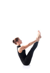 Sporty young woman doing yoga practice isolated on white background - concept of healthy life
