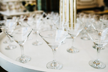 Many empty glasses for a wine drying in the bar. Close up photo 