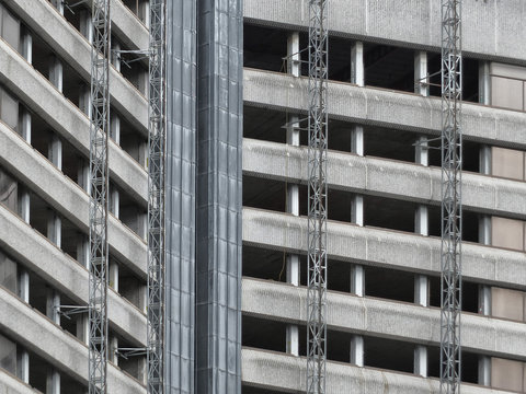 partly demolished old concrete high rise tower block building
