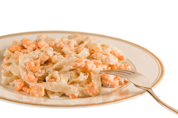 A plate with delicious fettuccine with shrimps