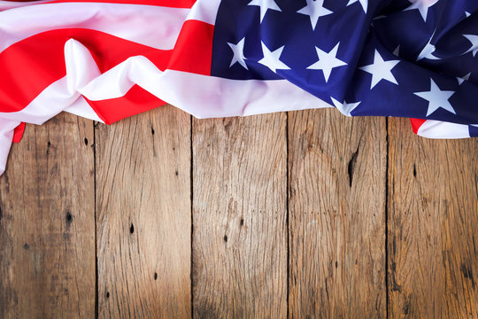 american flags on old wood for background.