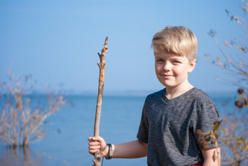 Young Boy by the Lake