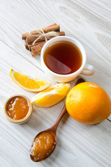 Cup of tea served with orange jam