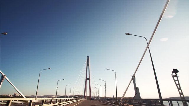 Driving along Russian bridge road. It is the world's longest cable-stayed bridge connecting the mainland part of Vladivostok with Russian Island. Russia