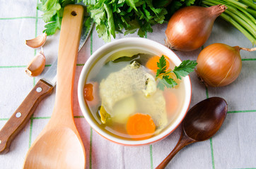 Fish soup served on the table in plate