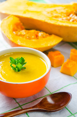 Pumpkin soup served on the table in bowl