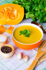 Pumpkin soup served on the table in bowl