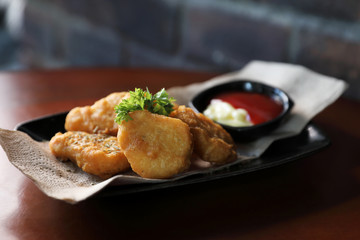 Nuggets on wood background vintage style , appetizer