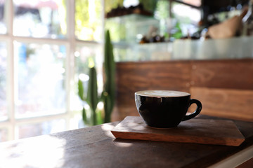Cappuccino coffee break on wood background