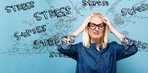 Young woman feeling stressed on a blue background