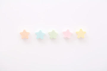 Colourful Star Milk pellets isolated in white background