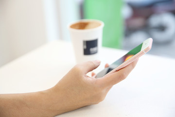 business trading online on smartphone with woman hand