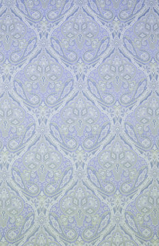 Textured Fabric Background with Floral Swirls and Paisley Designs