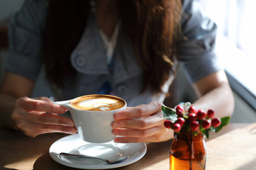 Cappuccino coffee break on wood background