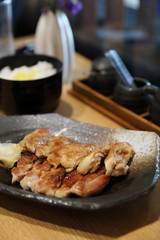 japanese food , Chicken teriyaki with rice on wood background