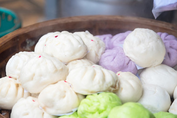 Chinese dumplings being steamed on the traditional bamboo pan.Thailand.