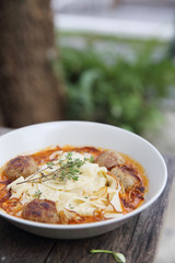 Pasta meatballs tomato sauce on wood background