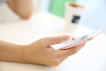 business trading online on smartphone with woman hand