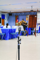 microphone wireless in a meeting room seminar conference background: Select focus with shallow depth of field.