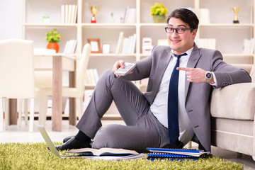 Fototapeta premium Businessman working on the floor at home
