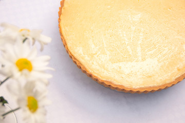 Obraz na płótnie Canvas Lemon pie with meringue and lemon slices and shell