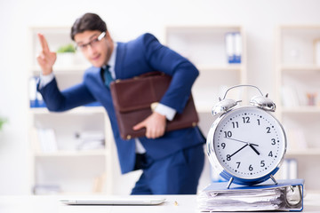 Businessman in rush trying to meet deadline