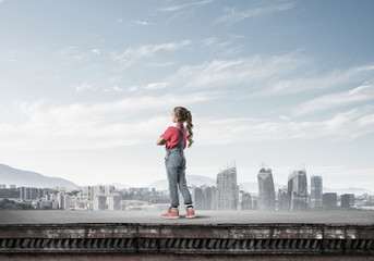 Concept of careless happy childhood with girl looking far away
