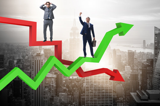 Businessman with charts of growth and decline