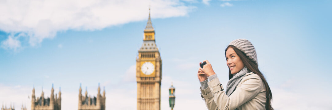 London europe travel woman taking pictures with phone panorama banner. Tourist holding smartphone camera taking photos at Big Ben, Westminster Bridge, London, England.