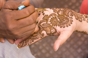 applying henna on hand, Hindu wedding ,Rajasthan, India