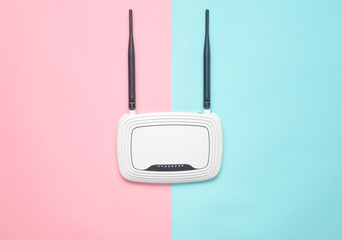 Wi-Fi router on a colored pastel background. Trend of minimalism. Always online. Top view. - obrazy, fototapety, plakaty