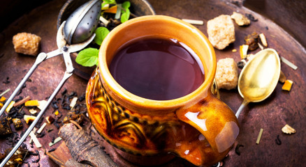 Green tea cup with tea leaves