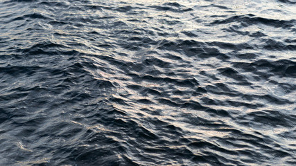 Sea surface as natural background, color toned.