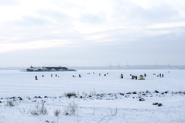 winter fishing on the sea the bright sun