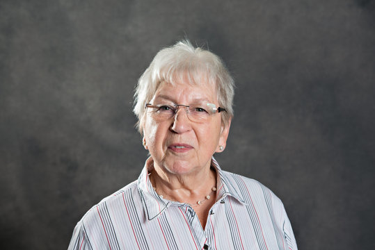 gray hairy elderly friendly woman