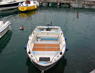 Fototapeta na wymiar Italy, Garda lake: Boat in Desenzano harbour: