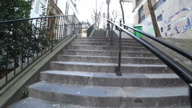 Paris,France-January 23, 2018: Long stone steps of Rue Chappe or Chappe street to Sacre Coeur in Montmartre, Paris
