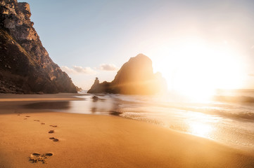 beautiful sandy atlantic ocean beach on sunset. Sintra, Portugal