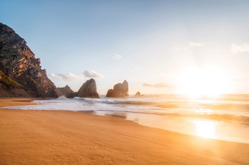 beautiful sandy atlantic ocean beach on sunset. Sintra, Portugal