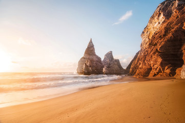 beautiful sandy atlantic ocean beach on sunset. Sintra, Portugal
