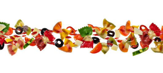 Flying food with traditional italian farfalle pasta and vegetable.