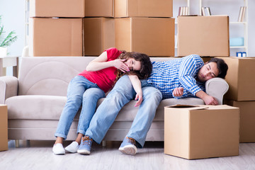 Young pair moving in to new house with boxes