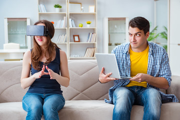 Young family playing games with virtual reality glasses