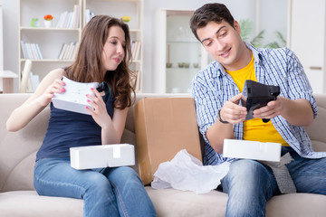 Young family playing games with virtual reality glasses