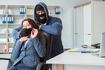 Criminal taking businesswoman as hostage in office