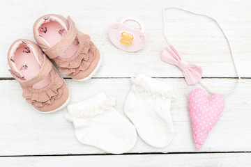 Children's shoes with socks and accessories for a baby girl. Flat lay