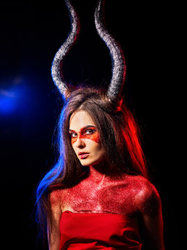 Mad satan woman on black magic ritual of hell. Witch reincarnation mythical creature Sabbath. Devil absorbing soul Halloween. Astral entities. Make-up for night club for demon inflicts damage.