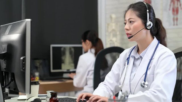 female doctor talking online phone help