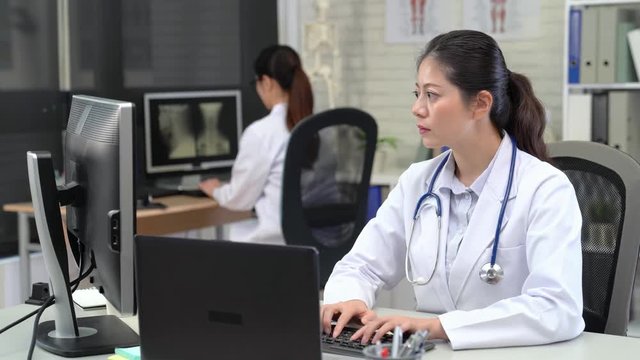 Portrait of an Asian female Doctor Working