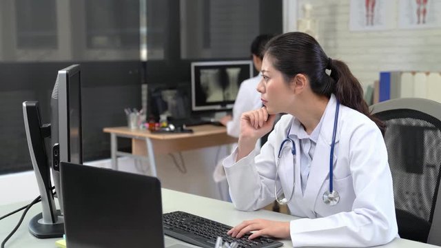 woman Doctor Working on Computer